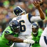 Seattles DK Metcalf makes a touchdown catch in front of L.A. Rams defensive back Marcus Peters during the Seahawks 30-29 win Thursday at CenturyLink Field in Seattle. (Kevin Clark / The Herald)