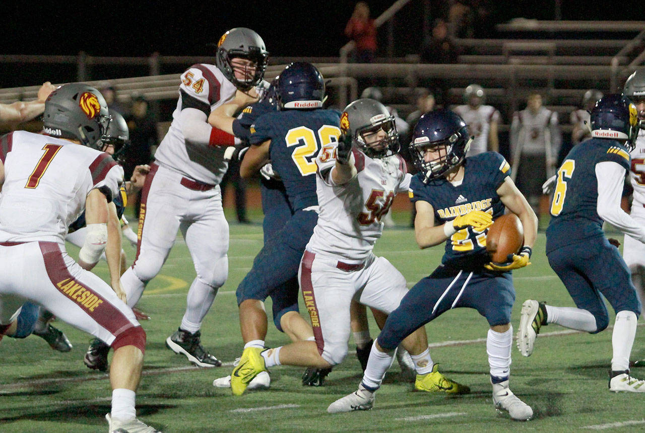 Luciano Marano | Bainbridge Island Review - Spartan junior Cal Breen dodges the greedy hand of a Lakeside defender last Friday during the homecoming game.