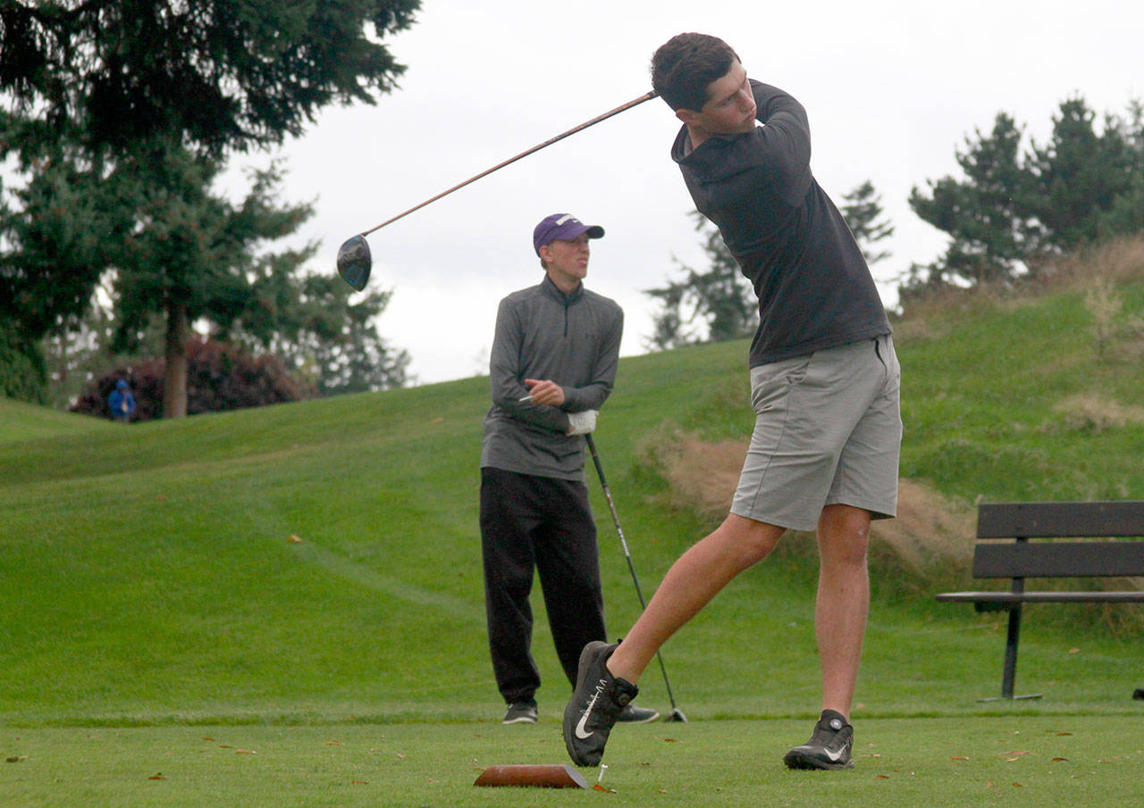 Luciano Marano | Bainbridge Island Review - tees off during the Spartans home match against Garfield Monday.                                Luciano Marano | Bainbridge Island Review - Justin Marten tees off during the Spartans home match against Garfield Monday.