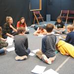 Luciano Marano | Bainbridge Island Review - The cast of B.I. Confidential read through lines during a recent rehearsal. The noir-style play, written by Scott Breitbarth, incorporates many trending topics from the Bainbridge Islanders Facebook groups page.