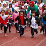 A drippy dash: St. Cecilia jog-a-thon returns to Bainbridge High School track | Photo gallery