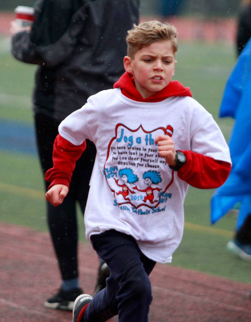 A drippy dash: St. Cecilia jog-a-thon returns to Bainbridge High School track | Photo gallery