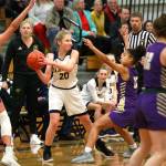 Luciano Marano | Bainbridge Island Review - Spartan sophomore Grace Colburn looks to pass the ball in action against the Viking at Paski Gymnasium.