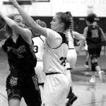 Luciano Marano | Bainbridge Island Review - The Bainbridge High varsity girls basketball team came up short against Roosevelt High School last Friday.                                 Luciano Marano | Bainbridge Island Review - Bainbridge Highs Paige Aichele attempts to block a shot during last Fridays game against Roosevelt.