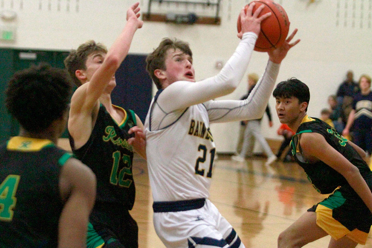 Luciano Marano | Bainbridge Island Review - Spartan junior Andrew Ward looks to make a layup during last Fridays home game against Roosevelt.