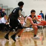 Luciano Marano | Bainbridge Island Review - Bainbridge junior Jacob Kirsch drives around a West Seattle defender last Friday.