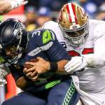 San Franciscos DeForest Buckner sacks Seattle Seahawks Russell Wilson in the second quarter Sunday evening at CenturyLink Field in Seattle on December 29, 2019. The 49ers led 13-0 at the half. (Kevin Clark / The Herald)