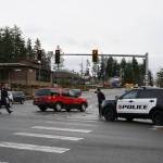 Luciano Marano | Bainbridge Island Review - About five police vehicles, one ambulance, one fire department vehicle and one fire truck were at the scene of the crash at the intersection of Highway 305 and High School Road Tuesday morning.