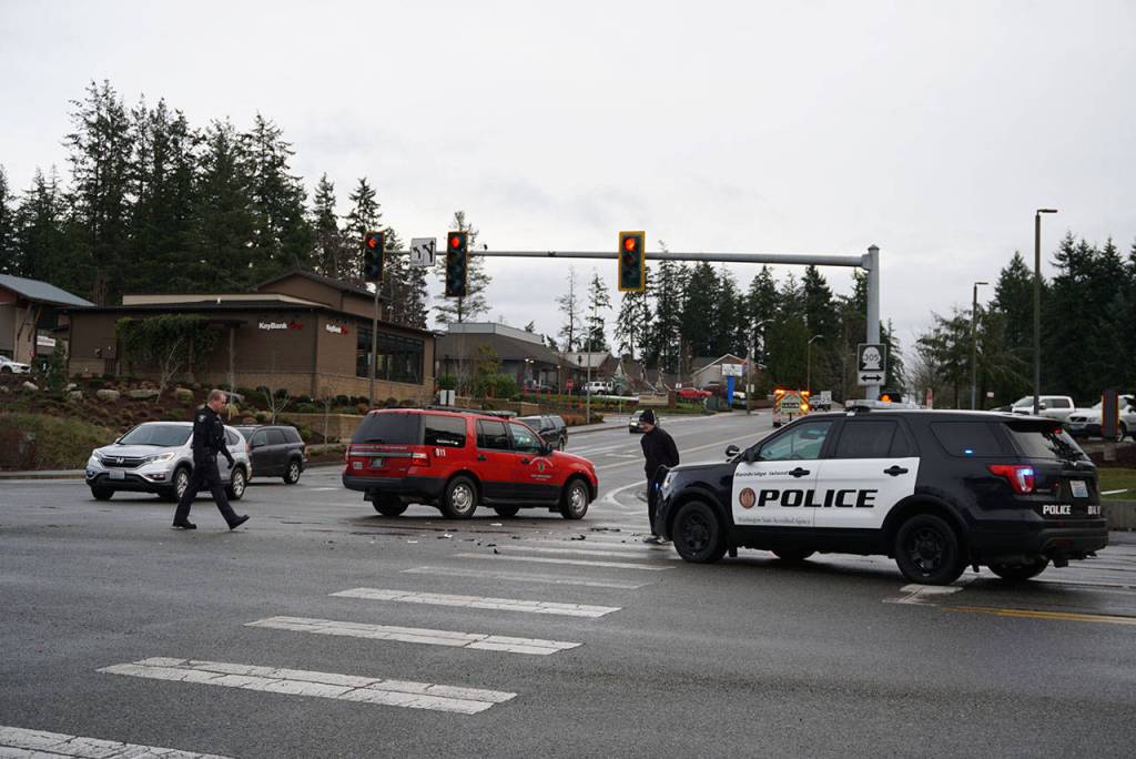 Luciano Marano | Bainbridge Island Review - About five police vehicles, one ambulance, one fire department vehicle and one fire truck were at the scene of the crash at the intersection of Highway 305 and High School Road Tuesday morning.