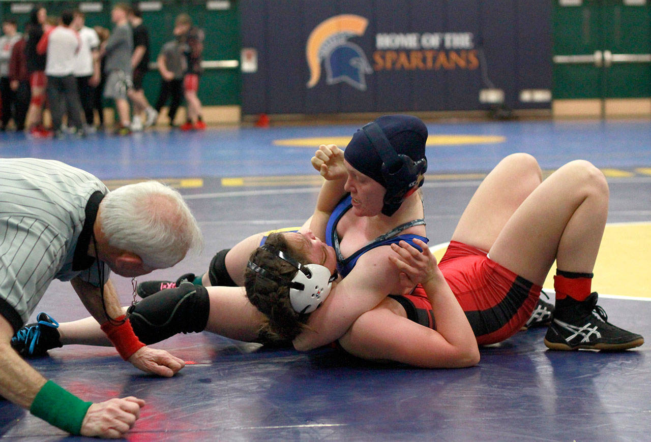 Luciano Marano | Bainbridge Island Review - Spartan senior, team captain Sagel Bush on the mat during last weeks Senior Night home match.