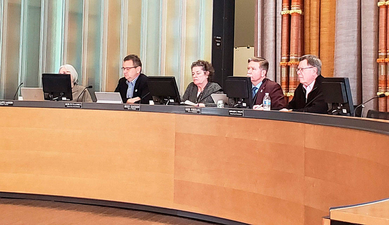 Kitsap County Commissioner Charlotte Garrido, Port Orchard Mayor Rob Putaansuu, Poulsbo Mayor Becky Erickson, Bremerton Mayor Greg Wheeler and County Commissioner Ed Wolf listen to a presentation on COVID-19 during this weeks meeting of the Kitsap Public Health Board. (Tyler Shuey | Kitsap News Group)