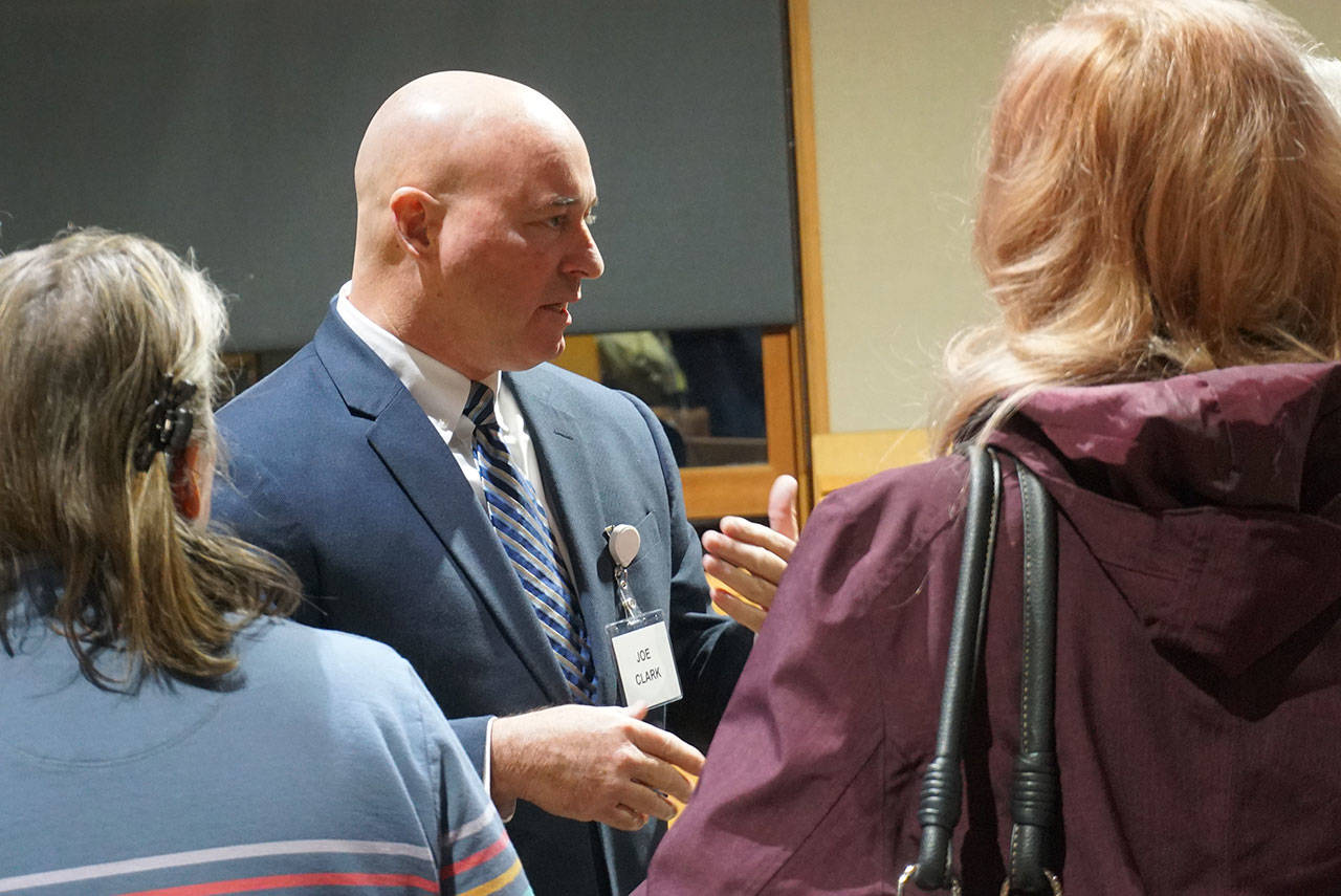 Joseph Joe Clark, former deputy police chief of the Norfolk Police Department in Norfolk, Virginia, talks to Bainbridge residents at a meet-and-greet in November. (Luciano Marano | Bainbridge Island Review)