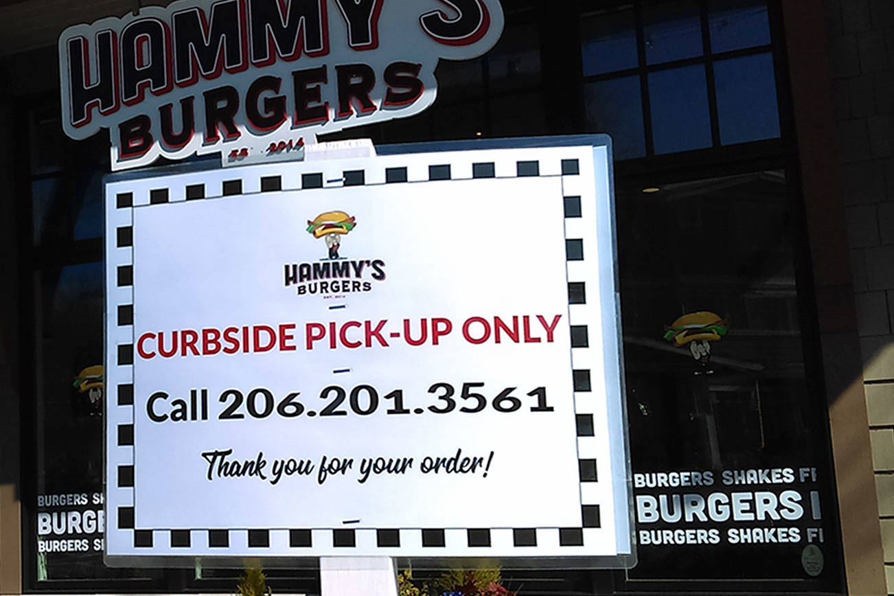 A temporary sign announces curbside pickup at Hammys. (Luciano Marano | Bainbridge Island Review)