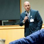 Joe Clark talks to Bainbridge residents during a meet-and-greet event for police chief finalists late last year at city hall. (Luciano Marano | Bainbridge Island Review)