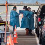Drive-thru COVID-19 virus testing in the parking lot near Everett Memorial Stadium in Everett. (Andy Bronson | The Herald)