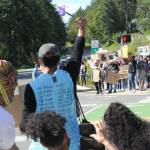 Protesters gather in Winslow as part of a demonstration organized by Kitsap ERACE Coalition. Photo by Nick Twietmeyer.