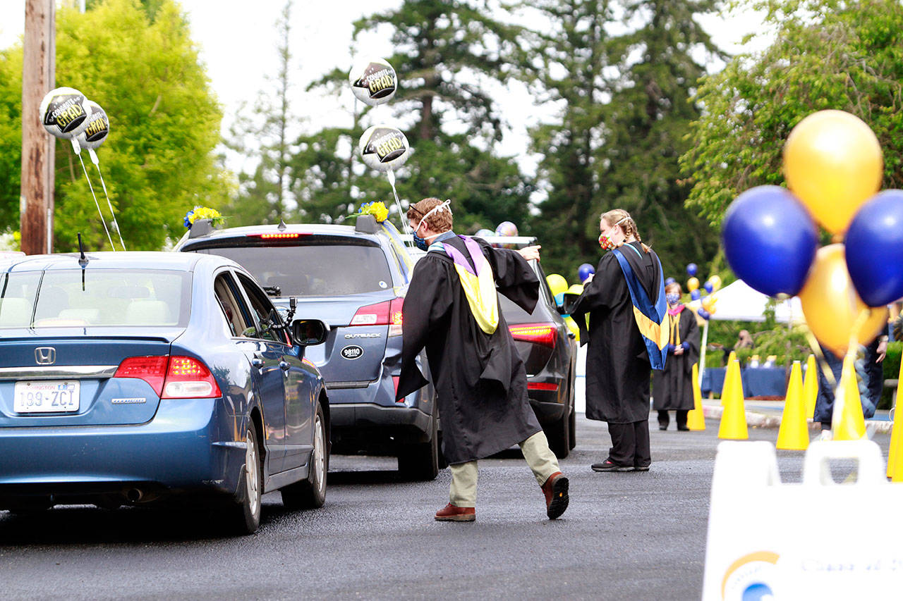 Photo gallery | Pomp despite circumstance: Drive-thru commencement celebrates island grads