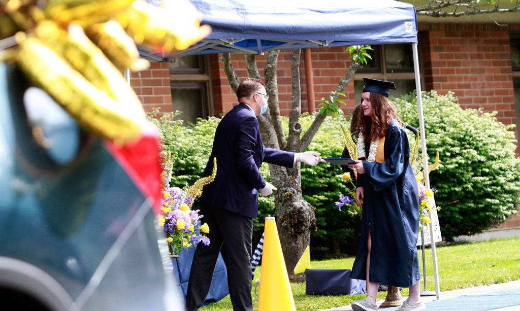 Photo gallery | Pomp despite circumstance: Drive-thru commencement celebrates island grads