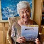 Photo courtesy of Amba Gale | Bainbridge Island leadership guru Amba Gale with her debut book Crossing Thresholds, a collection of poetry, prompts and photographs, available now.