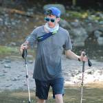 Island resident Greg Nance pulls up to the end of Point Monroe Drive near Fay Bainbridge Park during his endurance run around Bainbridge. (Mark Krulish/Kitsap News Group)