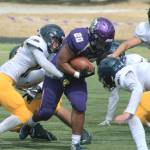 North Kitsap running back Isaiah Kahana powers his way up the field against Bainbridge. (File photo)