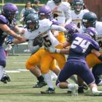 Bainbridge running back Alex Ledbetter tries to break away from the pile during the Spartans 2018 opener against North Kitsap. (File photo)