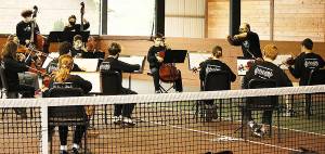 Tigran Arakelyan conducts the orchestra at a farm that has covered tennis courts. Joy Tappen/Courtesy photos