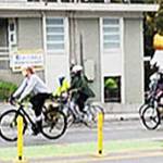 Bicyclists pedal along Winslow Way.