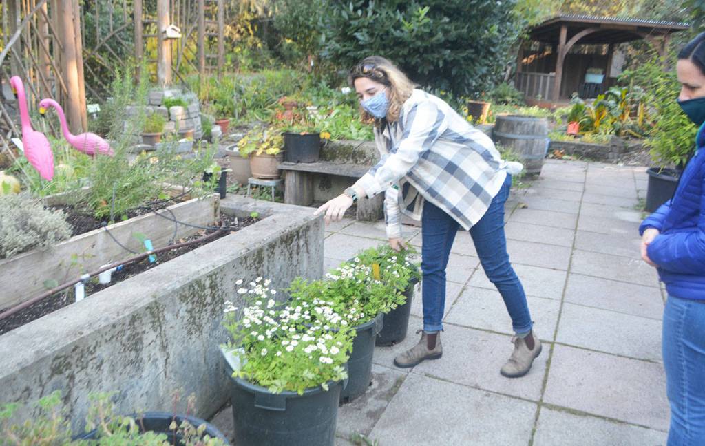 Breanna Caruso shows some plants students will tend to during their stay.