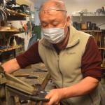 Chum Cho works in his shoe repair store. Steve Powell/Bainbridge Island Review photos