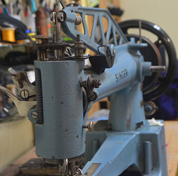 An old industrial Singer sewing machine.