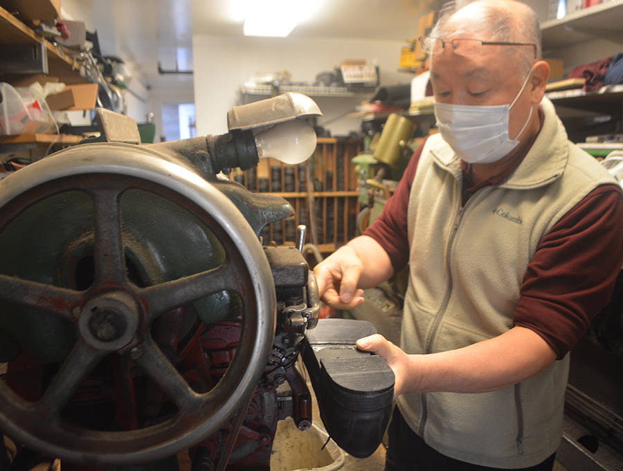 Chum Cho staples a shoe.