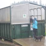 Mollie Bogardus opens up the enclosure used for composting. She would want to have about four of them on the Triangle property.