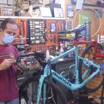 Owner Paul Johnson repairs a bicycle at Classic Cycle on Winslow Way. Steve Powell/Bainbridge Island Review photographs