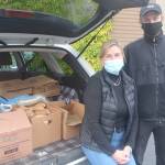 Molly Nikunen and her son David pick up food that will be prepared for the Thanksgiving Day meals. Steve Powell/Bainbridge Island Review