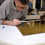 Greg Bonciolini working on the Kelly stained glass window. Courtesy Photo
