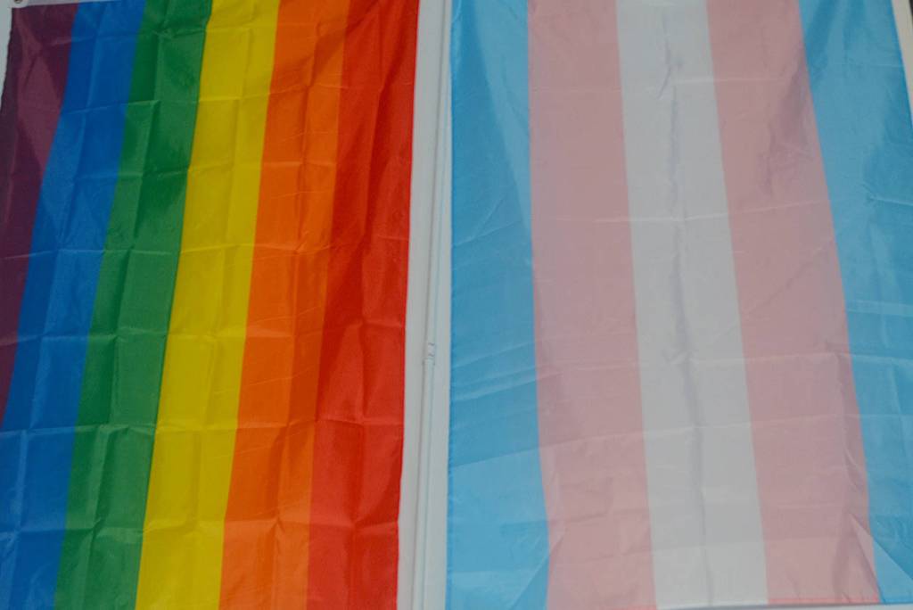 The all-inclusive gym has PRIDE and transgender flags hanging on the wall.