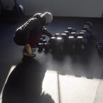 Bethanee Randles moves around kettle balls at the facility.