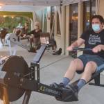 Clients work on on rowing machines outside under canopies. Steve Powell/Bainbridge Island Review photos
