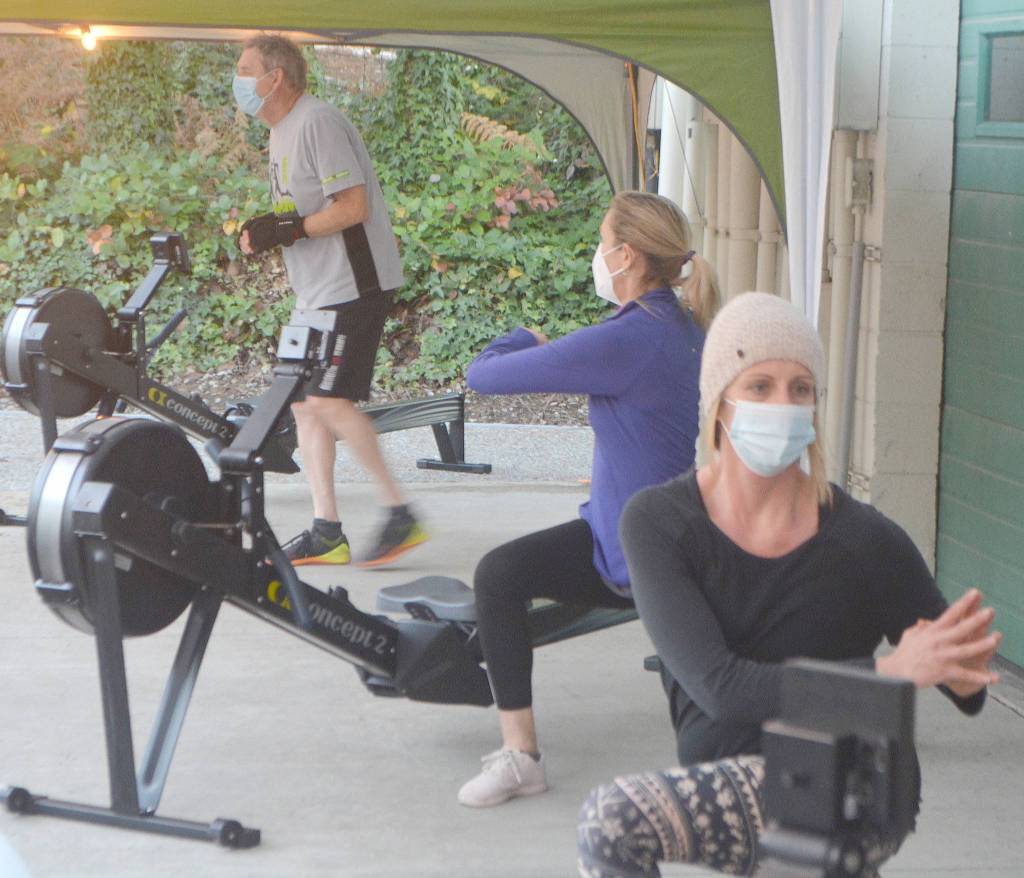 Members stretch before getting into more vigorous parts of the workout.