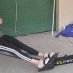 Jennifer Wallach pulls back on a rowing machine.