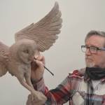 Jeff Oens adds detail to an owl. Steve Powell/Bainbridge Island Review photographs