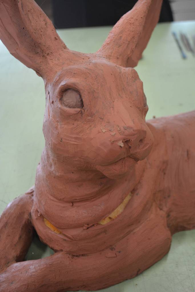 On the rabbits neck you can see foam, which is used to help shape the artwork. Clay goes over the top of that.