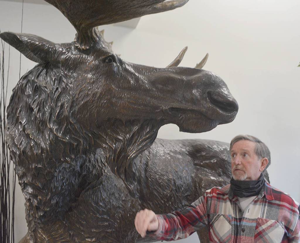 Jeff Oens and the lifesize moose sculpture that put him on the map.