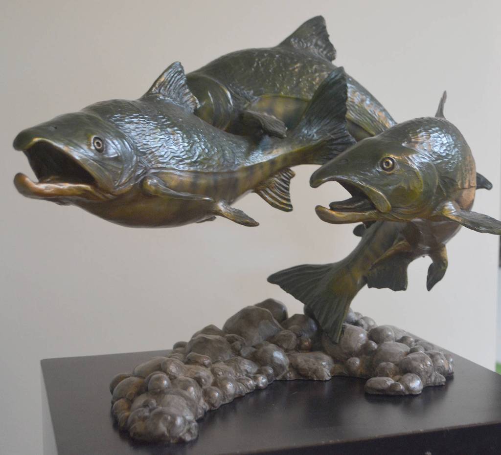 Three chum salmon are a part of this piece.