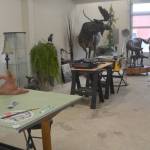 Above: The studio where Jeff Oens does his artwork. Right: A jockey rides a horse in a race. Bottom right: Three chum salmon are a part of this piece. Below: The finished clay process of Jeff Oens famous Eli Creekmore statue.