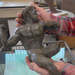 A wax piece comes out of the mold.