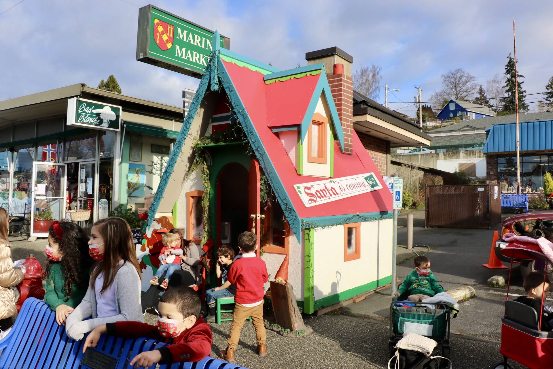Children from Precious Blessings Pre-School and Day Care gathered outside Santa's Cottage, waiting their turn to meet the man in red. KPark/NKH