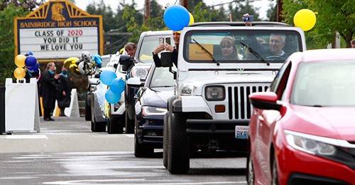 Bainbridge High School graduation was different this year, due to COVID-19 restrictions, as students were driven through town in cars and individually got out to get their diplomas.