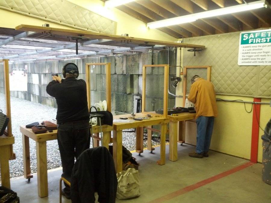 Participants keep their distance at the pistol range.